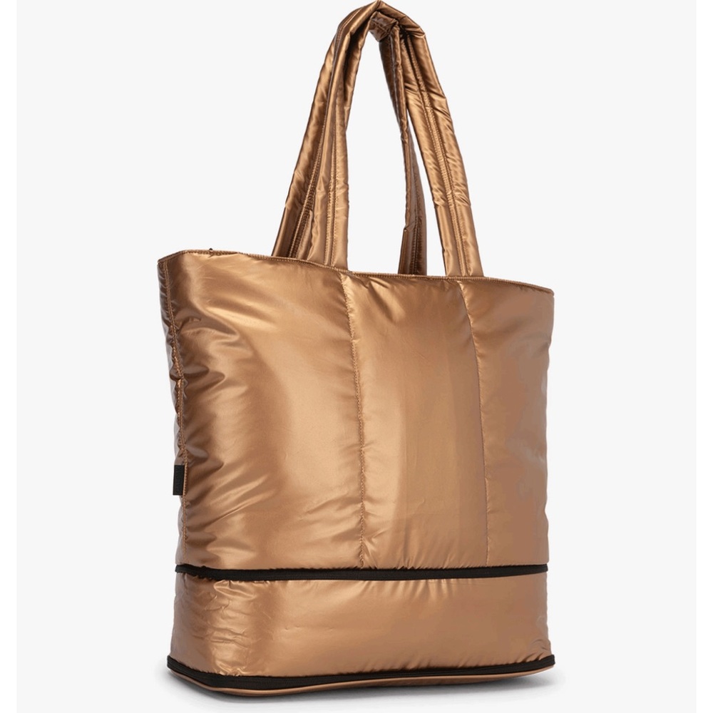 Luka expandable laptop tote. Soft puffy material. Copper color.